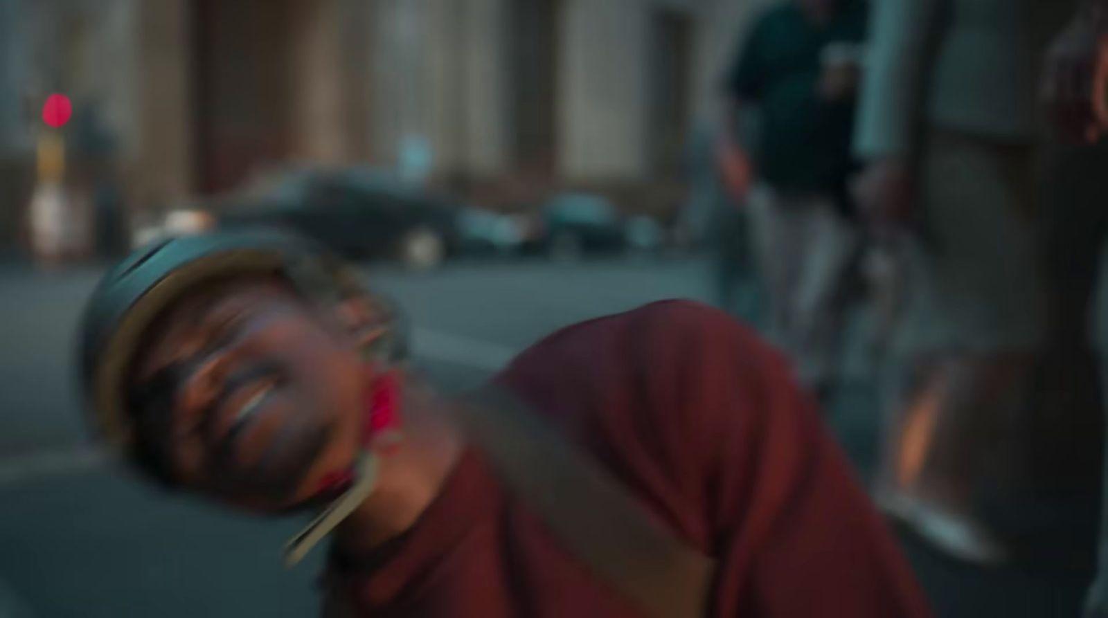 a blurry image of a man laughing on the street