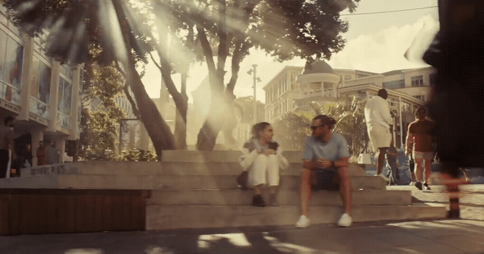 a group of people sitting on the steps of a building