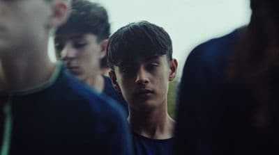 a group of young men standing next to each other