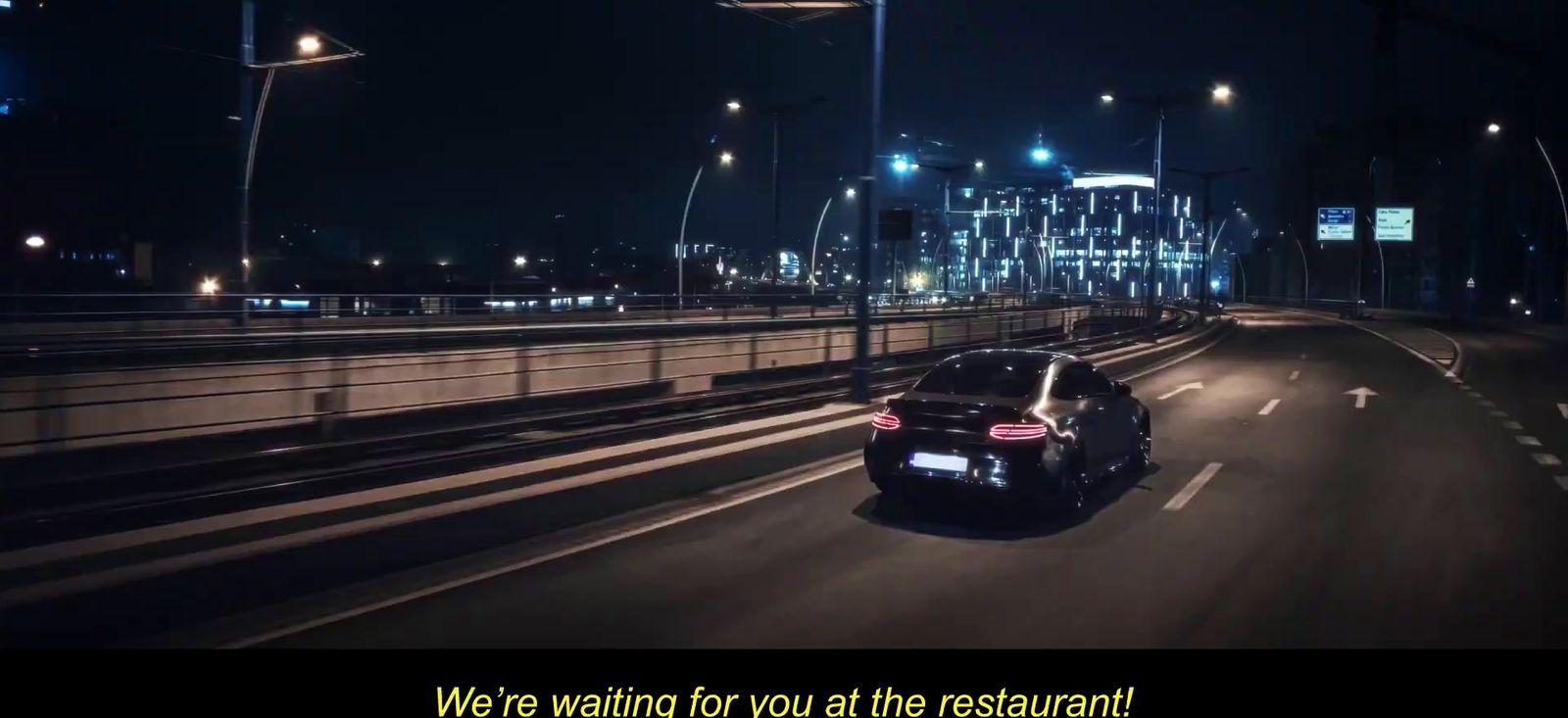 a car driving down a highway at night