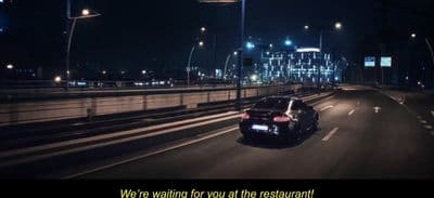 a car driving down a highway at night