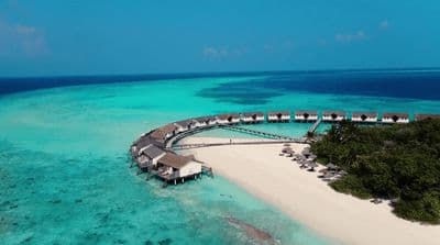 an aerial view of a resort on a tropical island