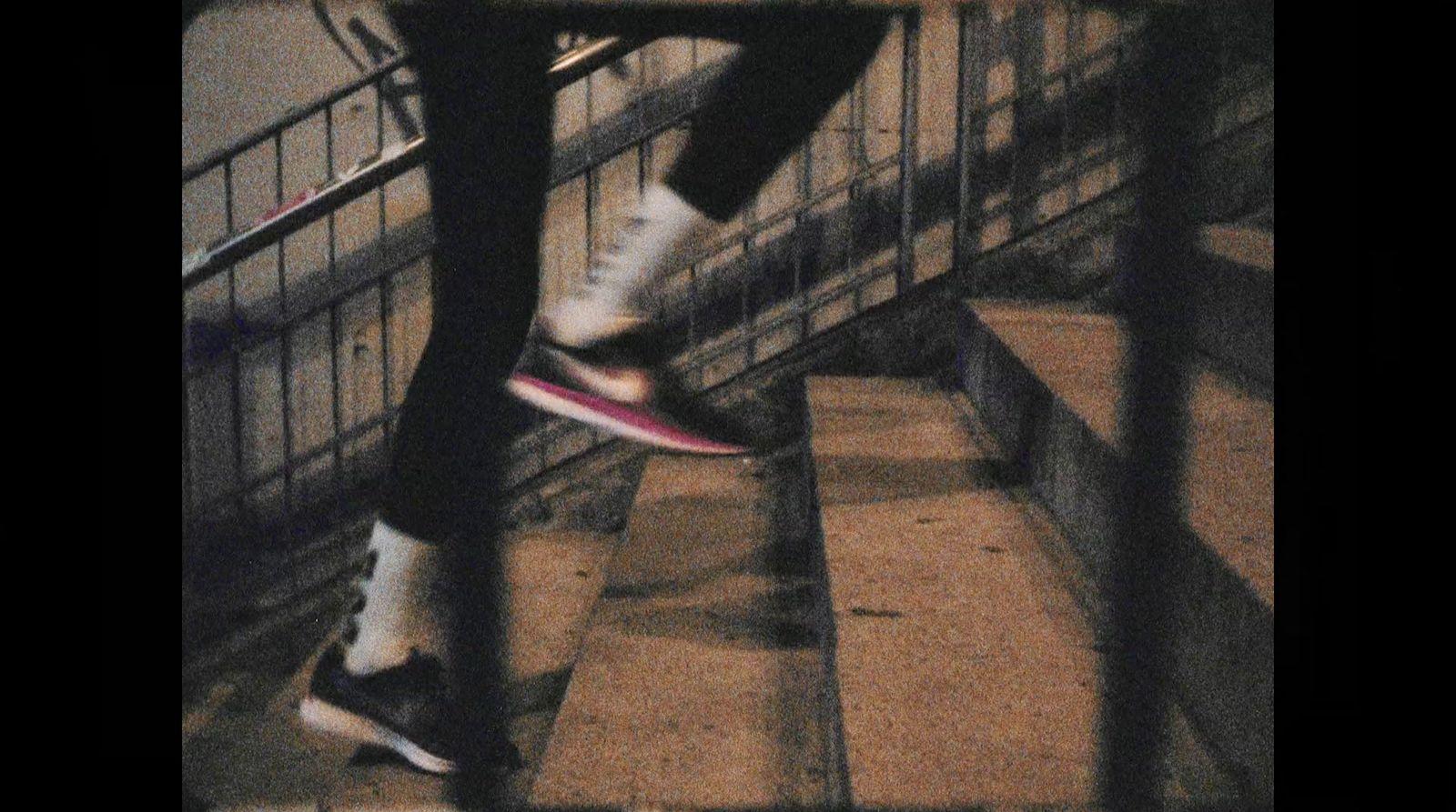 a person jumping a skate board down a flight of stairs