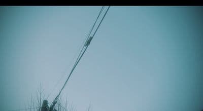 a person standing on top of a snow covered hill