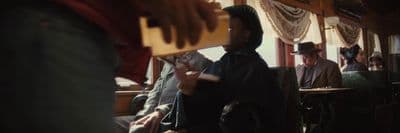 a group of people sitting in a train car