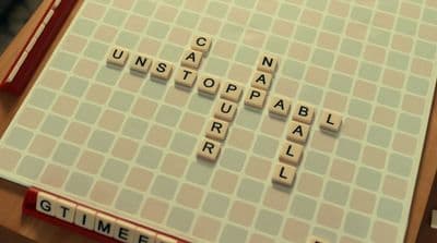 a scrabble board with letters that spell out words