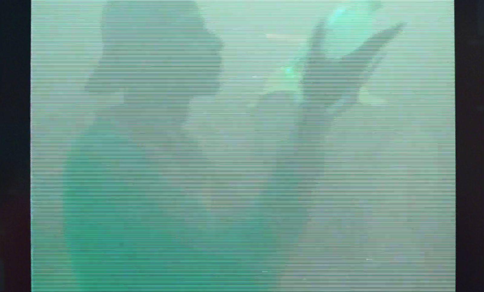 a blurry image of a person holding a cell phone