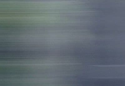 a blurry photo of a bird flying in the sky