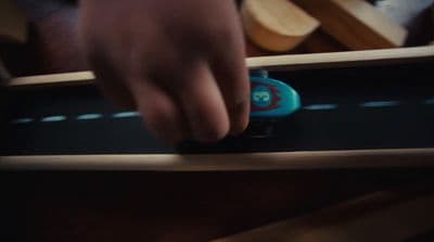a person is playing with a toy on a table
