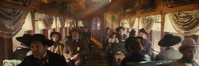a group of people riding on a train next to each other