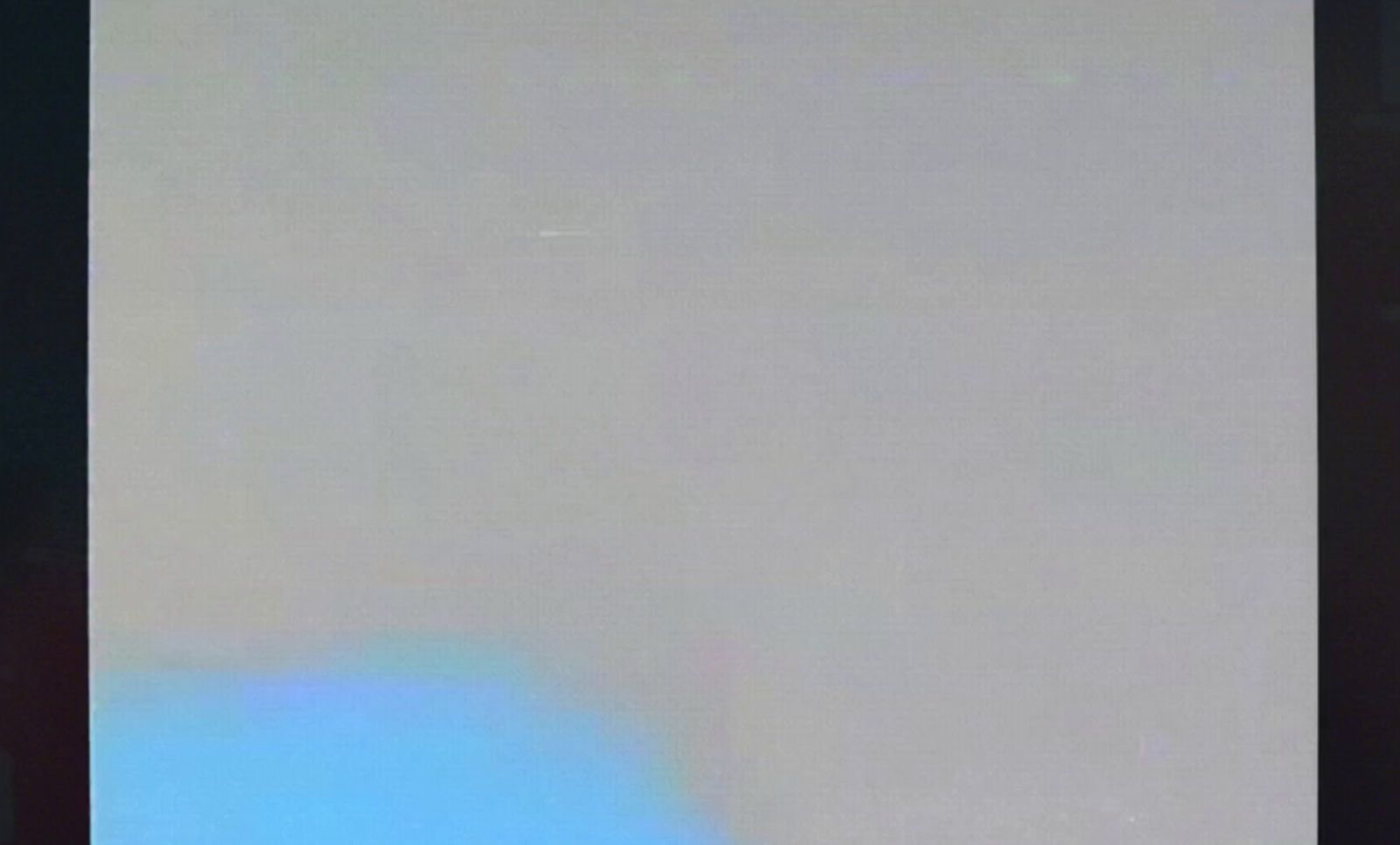 a black and white photo of an airplane in the sky