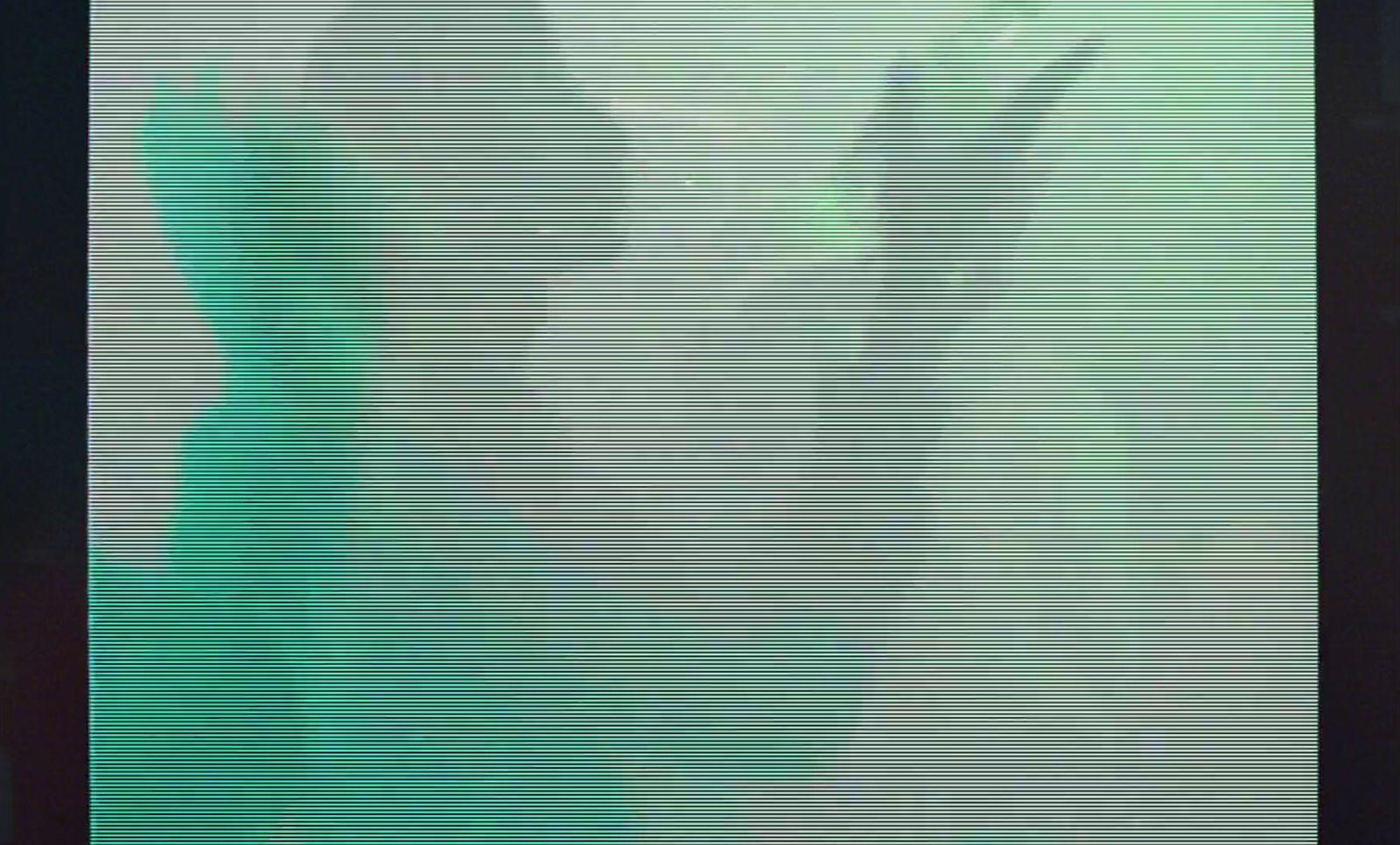a person standing in front of a large screen