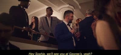 a group of people standing around each other