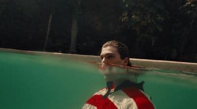 a man wearing a life jacket in the water