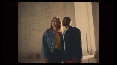 a man and a woman standing next to each other