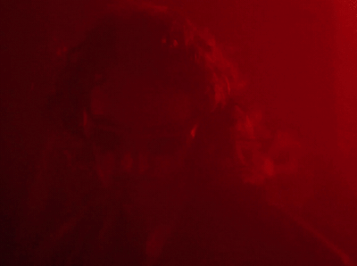 a man in a red room with a red light