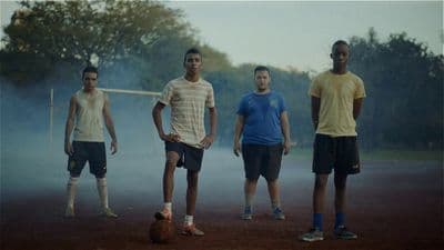 a group of young men standing next to each other