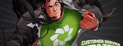 a man in a green shirt is holding a cell phone