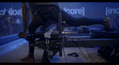 a man standing on top of a metal table