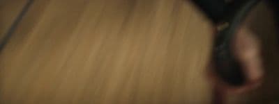 a blurry photo of a person holding a cell phone