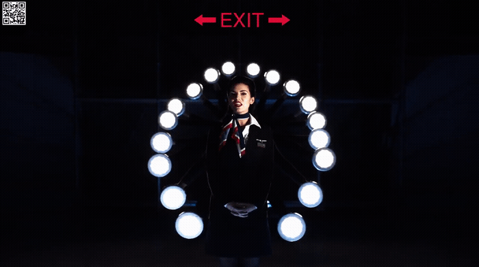 a man standing in front of a circular light