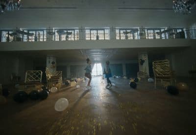 a couple of people that are standing in a room