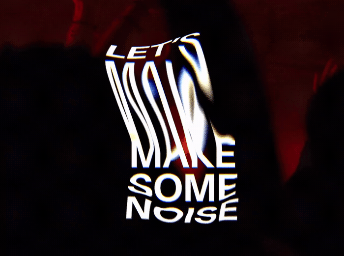 a close up of a cell phone with the words let's make some noise
