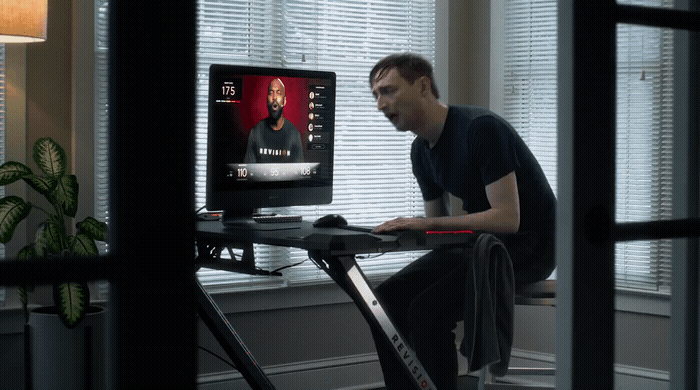 a man sitting at a desk using a computer