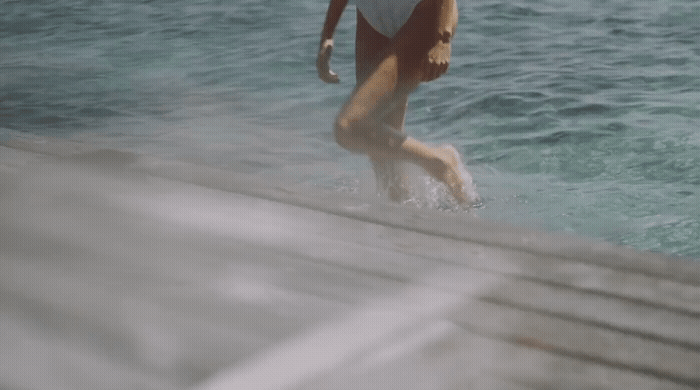 a woman in a bathing suit in the water