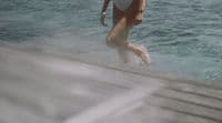 a woman in a bathing suit in the water