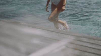 a woman in a bathing suit in the water