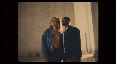 a man and a woman standing next to each other