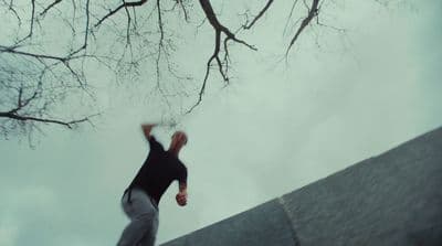 a man is doing a trick on a skateboard