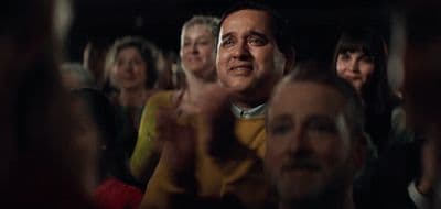 a group of people sitting next to each other