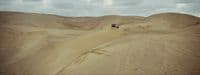 a couple of people riding on the back of a dirt bike