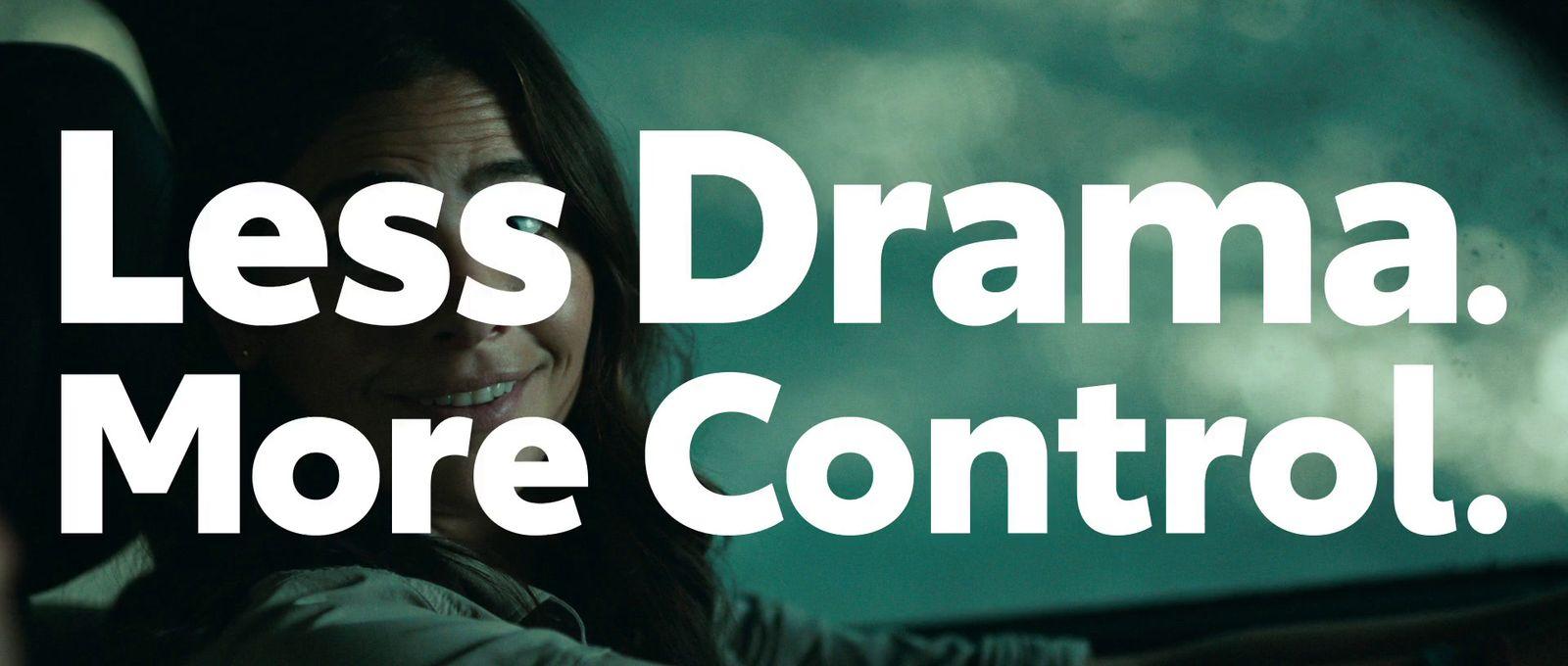 a woman driving a car with the words less drama, more control