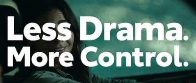 a woman driving a car with the words less drama, more control