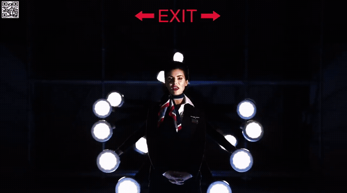 a man standing in front of a bunch of lights