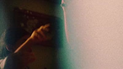 a blurry photo of a person holding a baseball bat