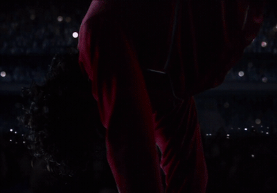 a person in a red outfit holding a cell phone