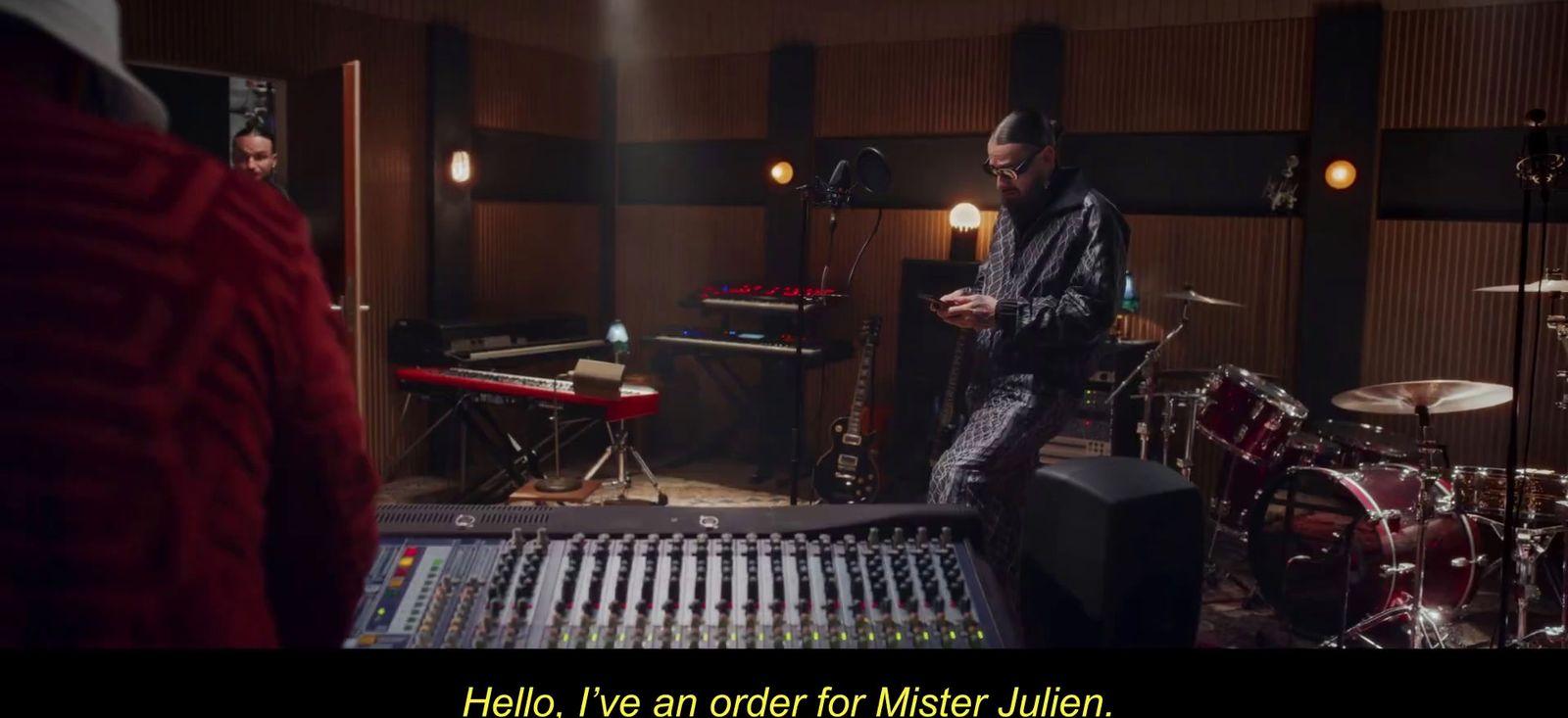 a man standing in front of a mixing desk
