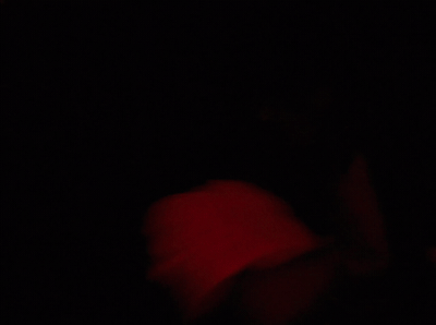 a blurry image of a red object in the dark