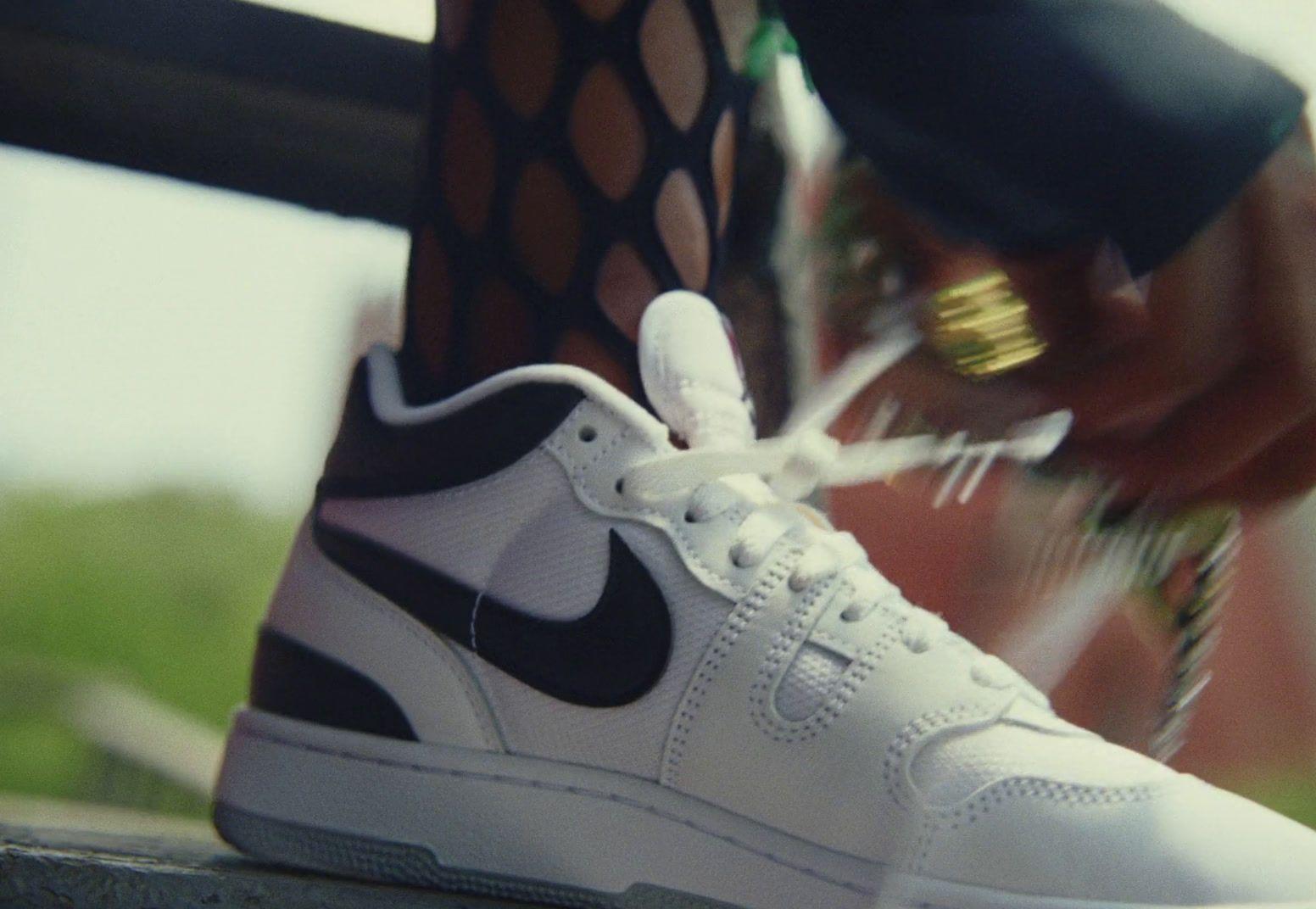 a close up of a person tying a shoelace