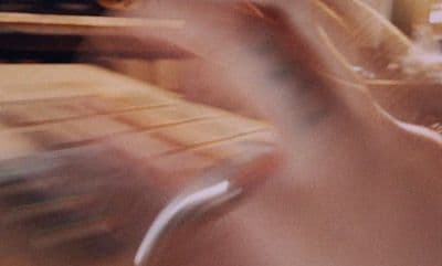 a blurry photo of a person playing a video game