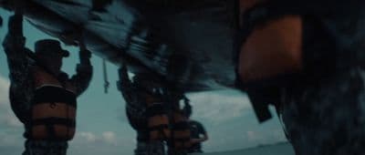 a group of people in life vests on a boat