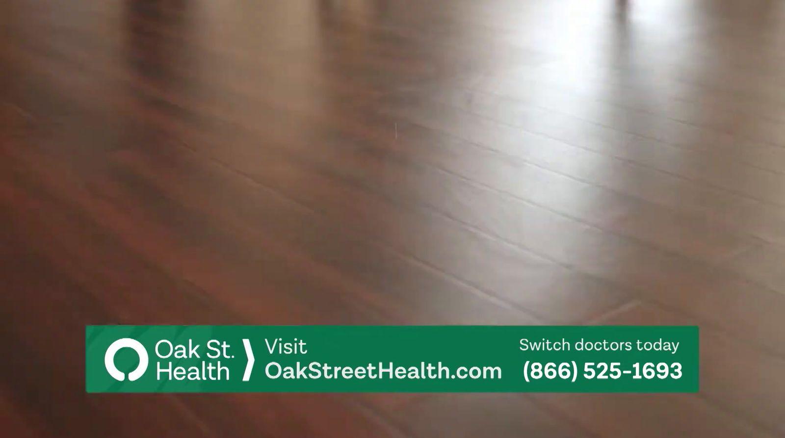 a wooden floor with a green sign that says oak st visit