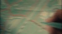 a blurry photo of a person holding a cell phone