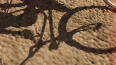 a shadow of a bike on the ground