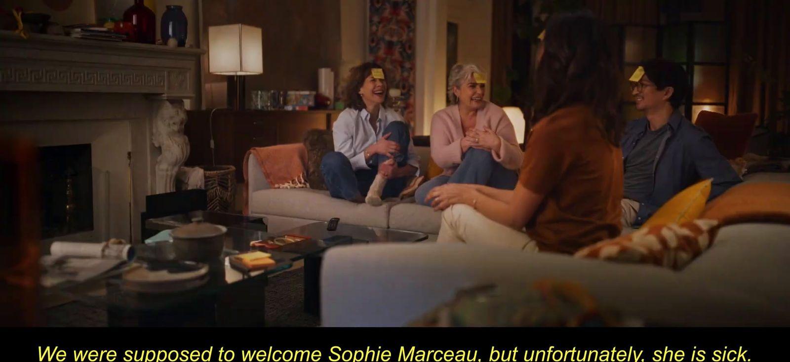 a group of people sitting around a living room together