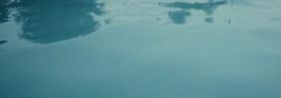 a reflection of a building in the water